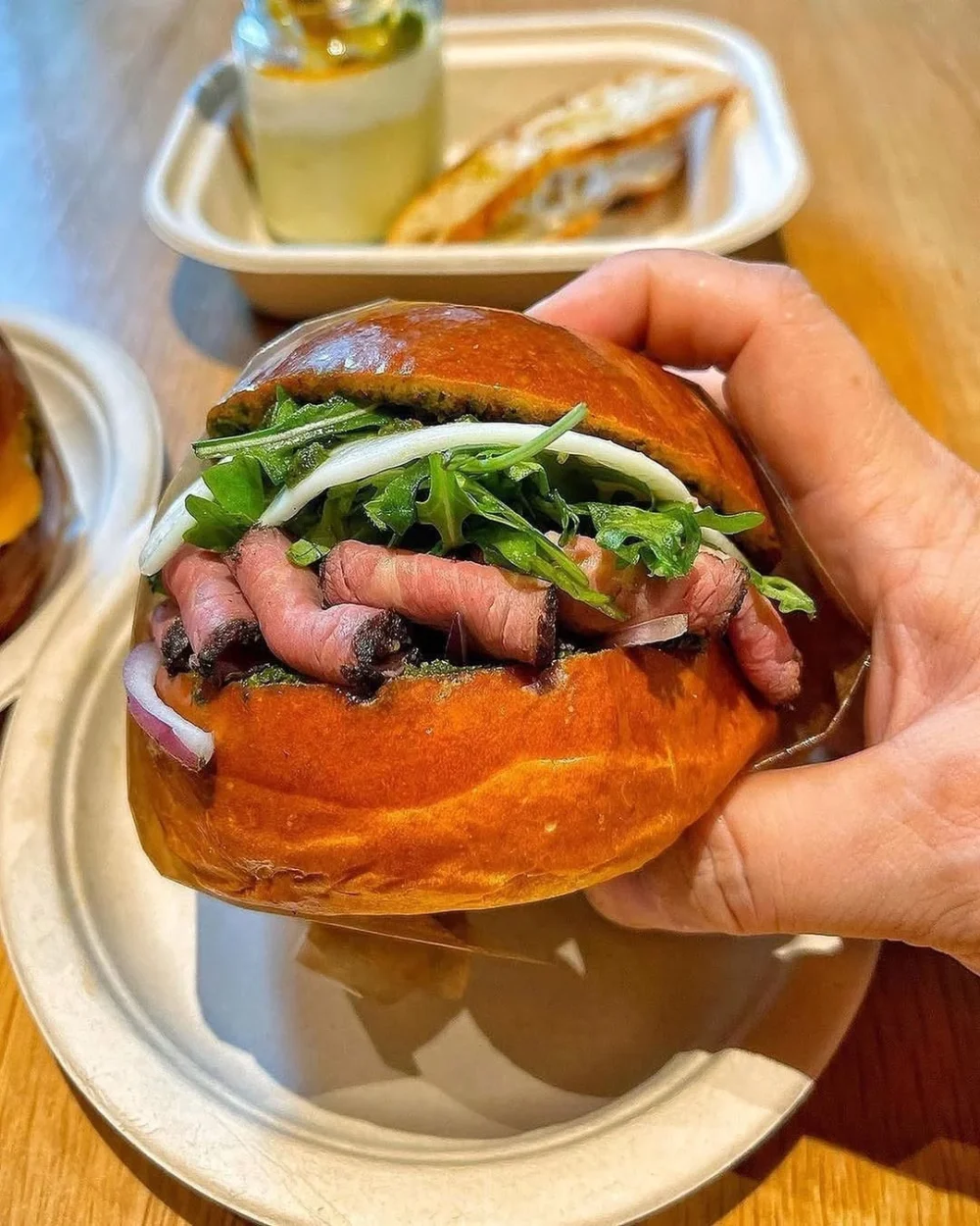GAUCHO seared wagyu tri-tip steak, cage-free over medium egg, chimichurri, red onions and dressed arugula in a warm brioche bunnot available at all locations @eggslutuk @foodilicious_diva מפת המלצות ללאס וגאס